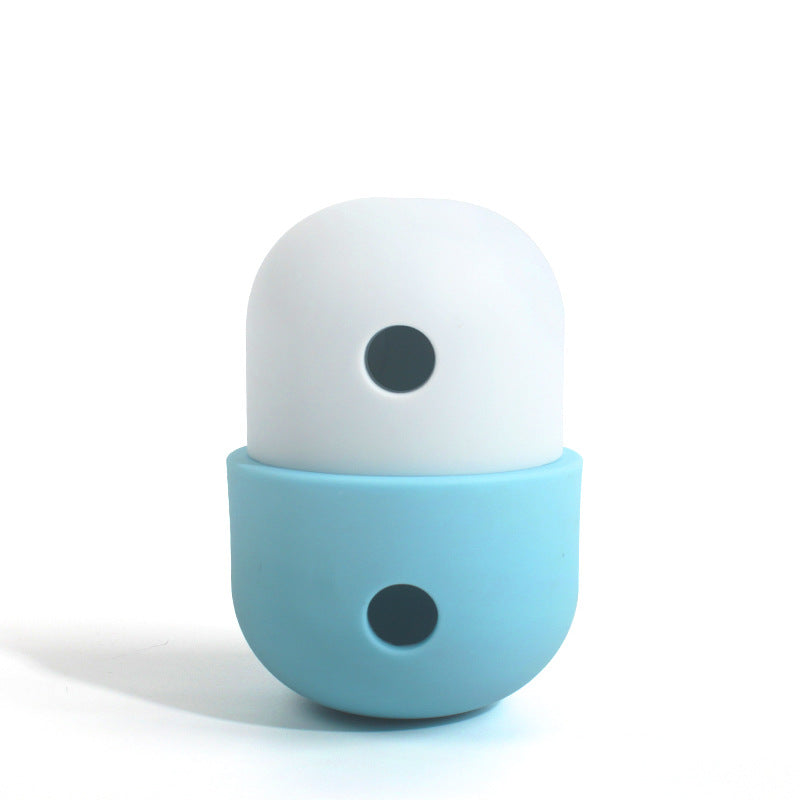 Ivory and light blue treat-dispensing pet toy