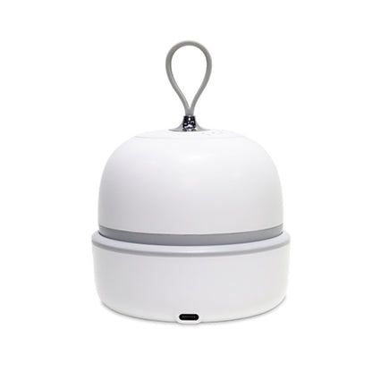 White rechargeable scalp massager resting in its base