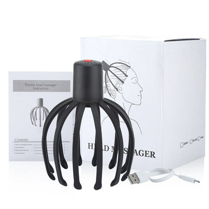 Black scalp massager pictured with box, instructions and cable