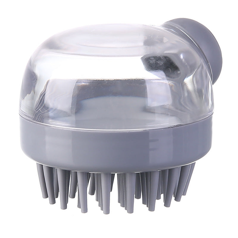 Gray shampoo-dispensing scalp brush on a white background