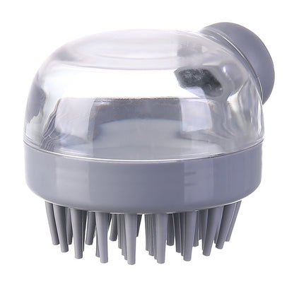 Gray shampoo-dispensing scalp brush on a white background