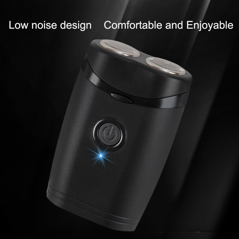 Angled close-up of the dual rotary shaving heads and power button