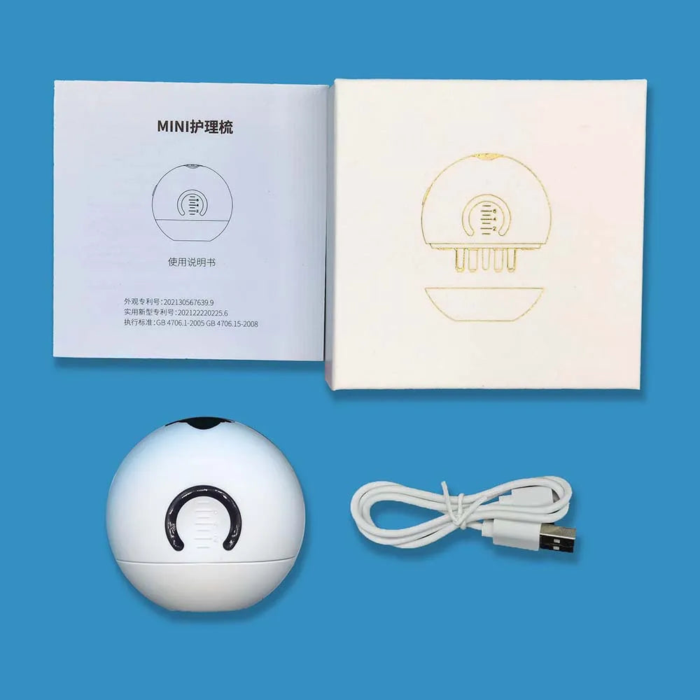 Scalp applicator pictured with USB cable, instructions and packaging