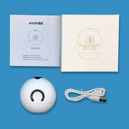 Scalp applicator pictured with USB cable, instructions and packaging