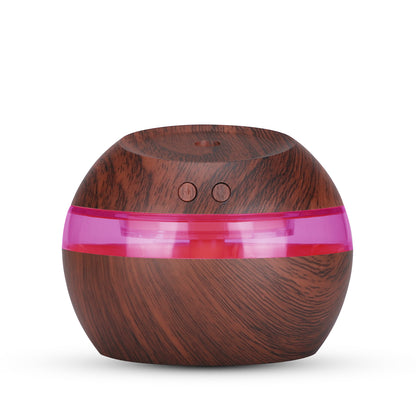 Dark woodgrain humidifier with a pink illuminated band