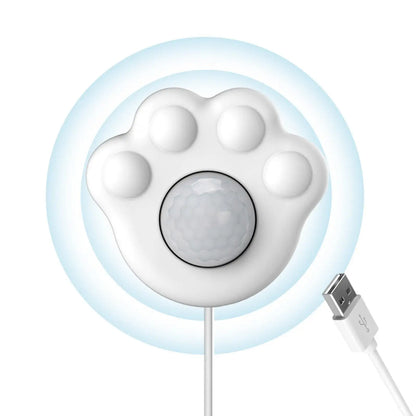 Front view of the paw-shaped fountain sensor and USB plug