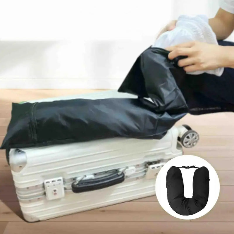 Person filling a smooth-fabric neck-pillow cover with clothing