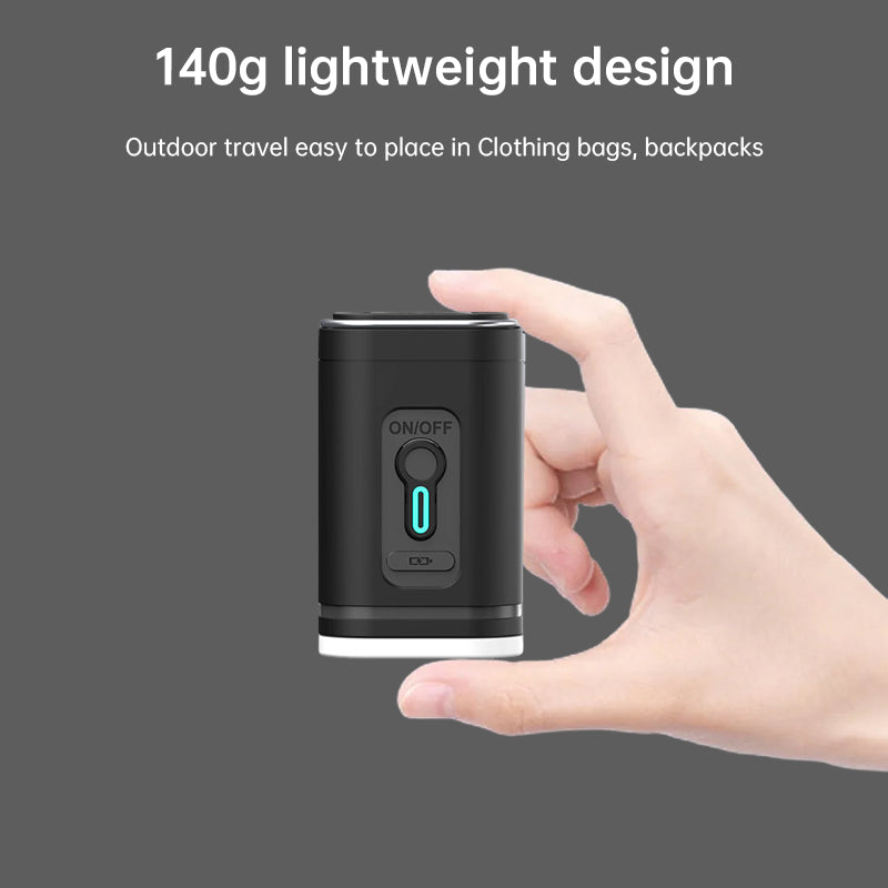 Small black travel pump held between fingers