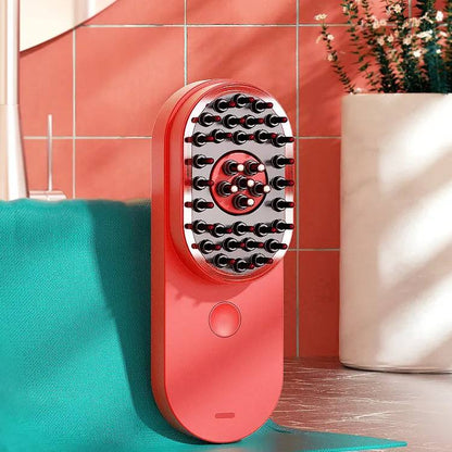 Red scalp applicator comb standing on a shelf