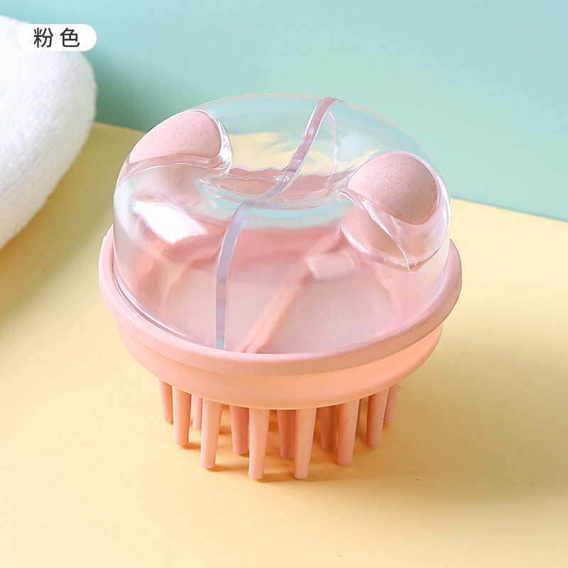 Top view of the pink shampoo brush and its clear reservoir