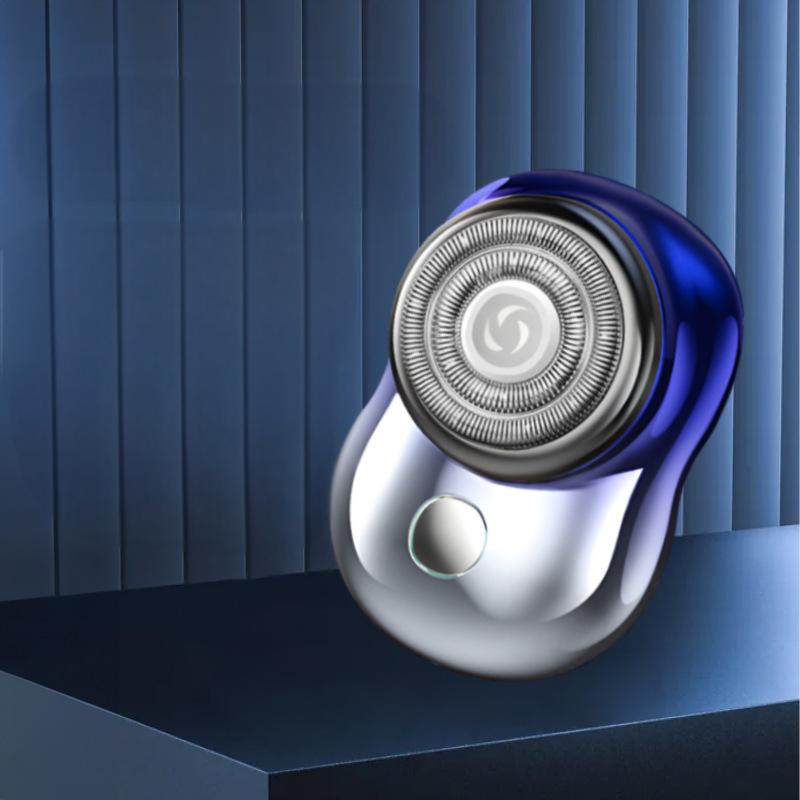 Gradient blue mini shaver displayed on a dark blue platform