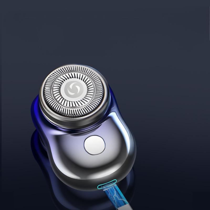 Mini electric shaver shown connected to a charging cable
