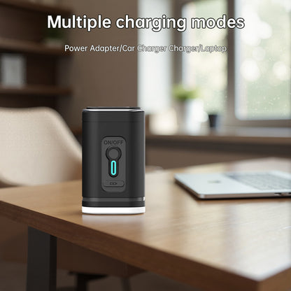Compact black pump connected to a charging cable