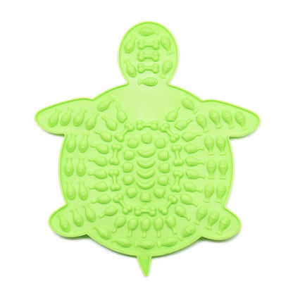Green turtle-shaped silicone pet lick mat with textured surface