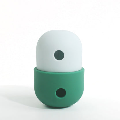 Ivory and dark green treat-dispensing pet toy