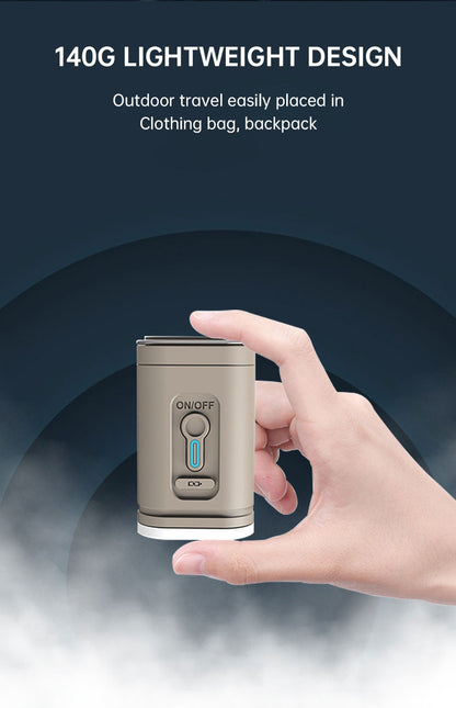 Size comparison showing the mini air pump held in one hand