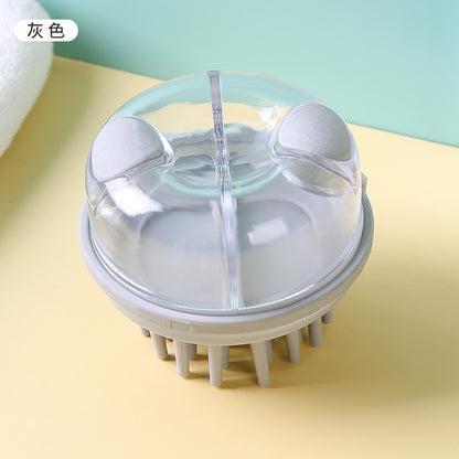 Top view of the gray shampoo brush and its clear reservoir