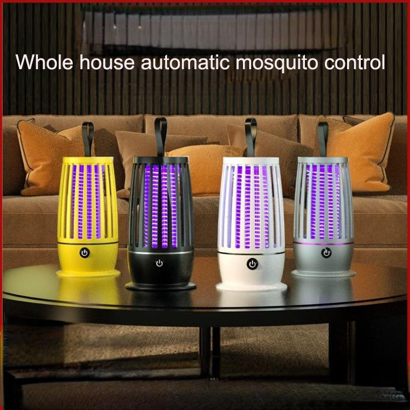 Yellow, black and white mosquito trap lamps displayed on a living-room table