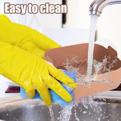 Silicone air fryer liner being washed under running water