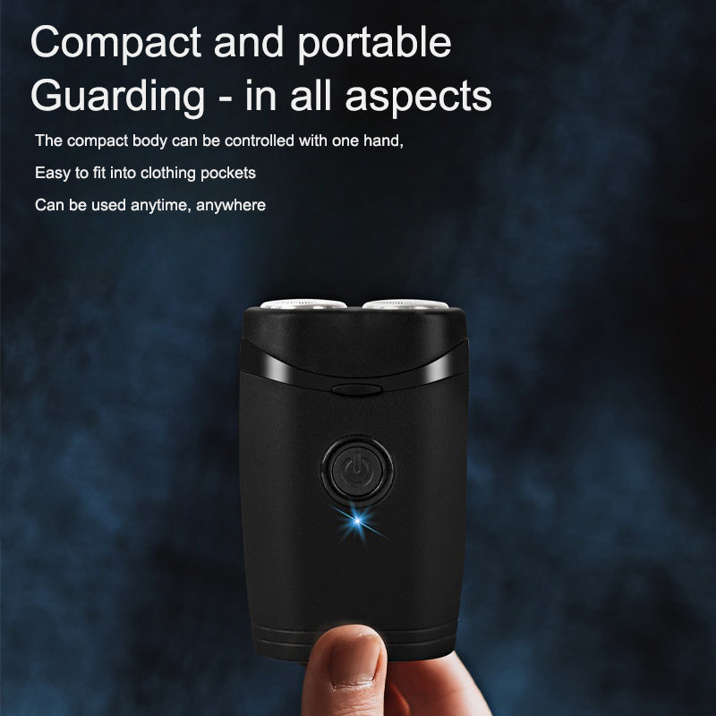 Black dual-head electric shaver held in one hand