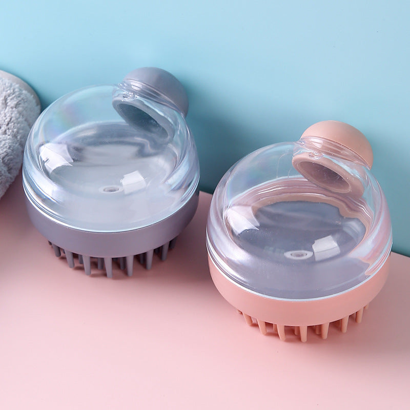 Pink and gray shampoo-dispensing scalp brushes with clear reservoirs