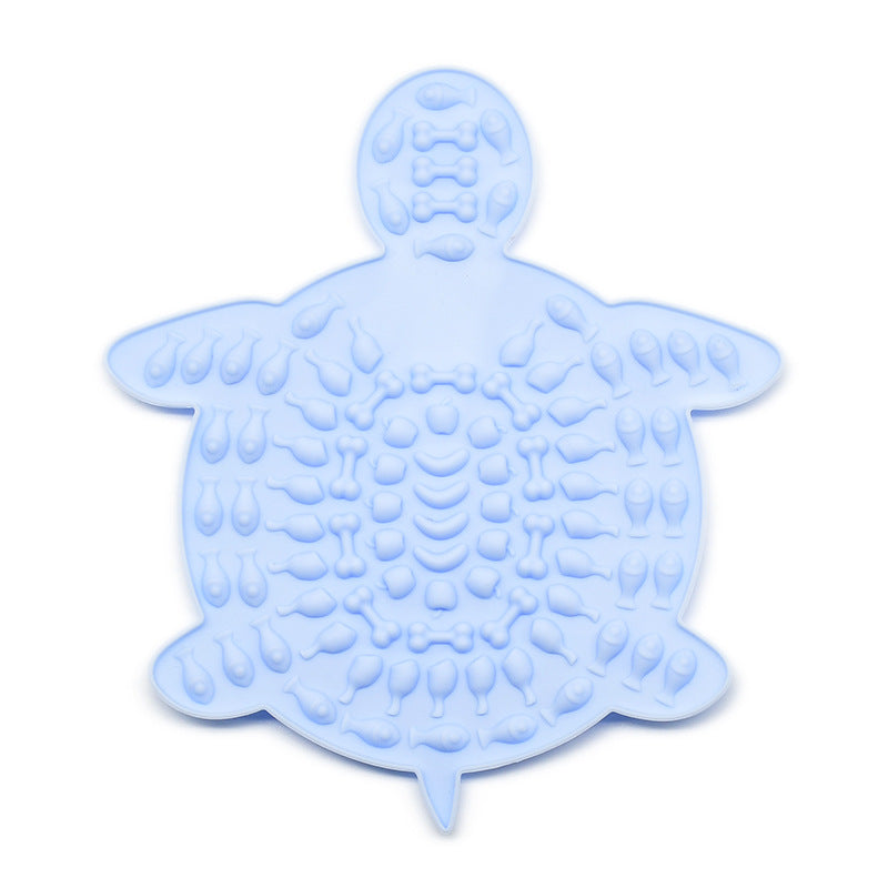 Blue turtle-shaped silicone pet lick mat with textured surface
