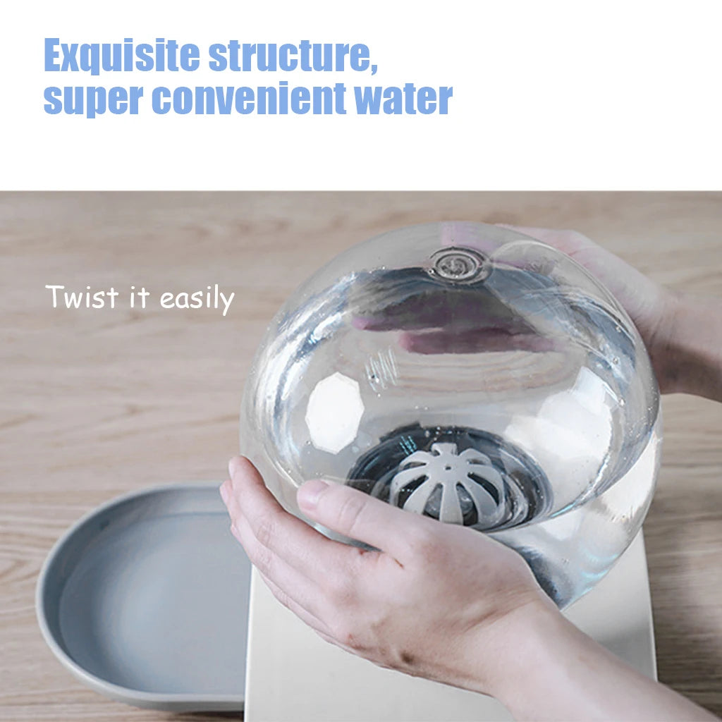 Hands removing the round water reservoir from the dispenser