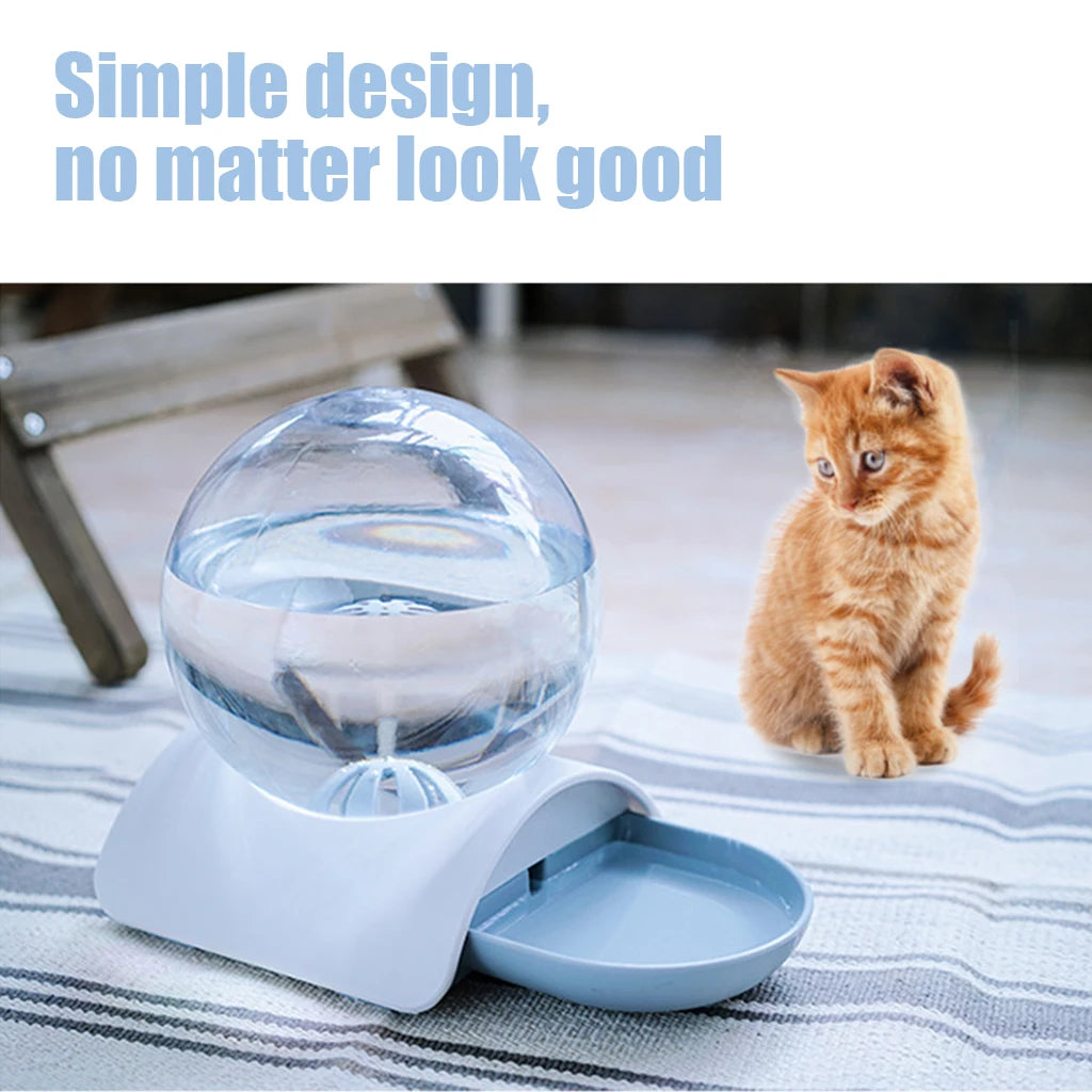 Gray gravity dispenser pictured beside a cat