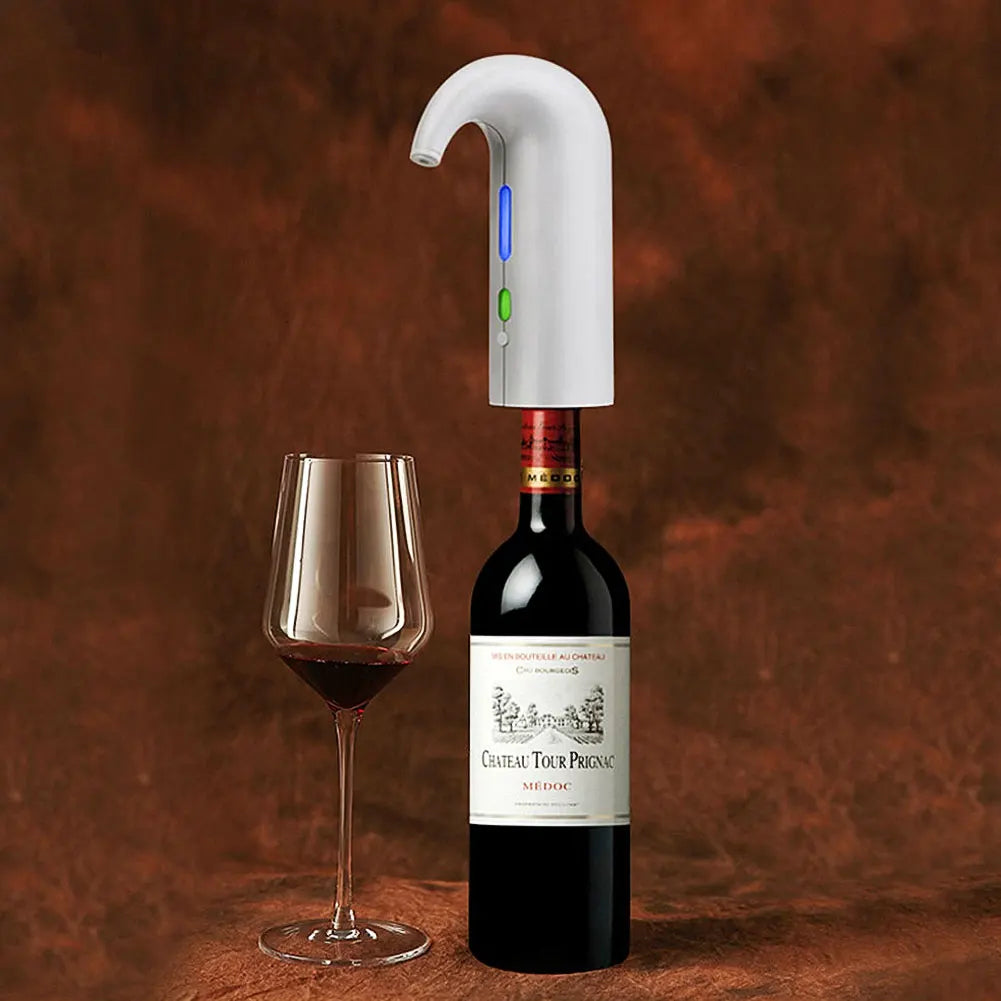 White wine aerator mounted on a bottle beside a glass