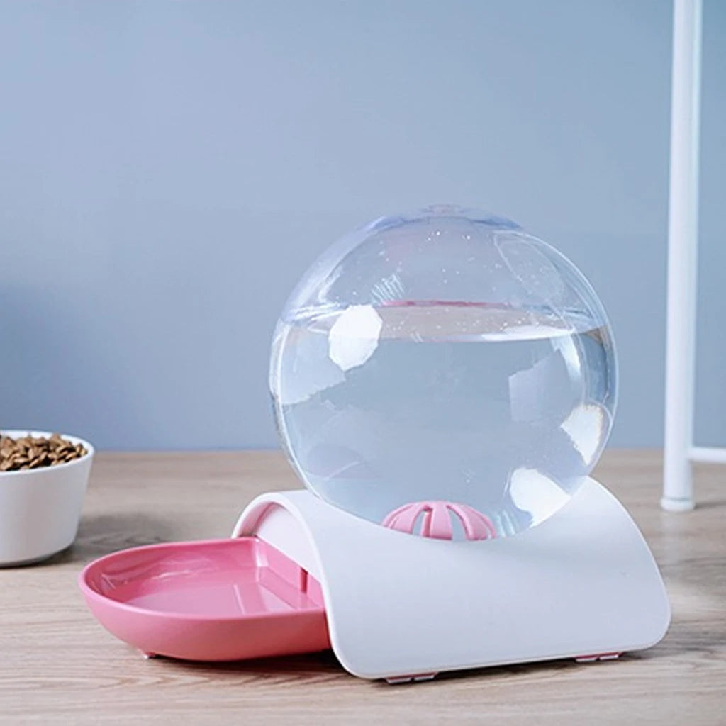 Clear-reservoir pet water dispenser with a pink bowl