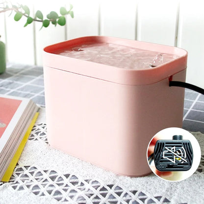 Pink USB pet fountain with a close-up of its pump